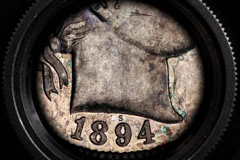 1894-S dime date and S mint mark detail under magnification