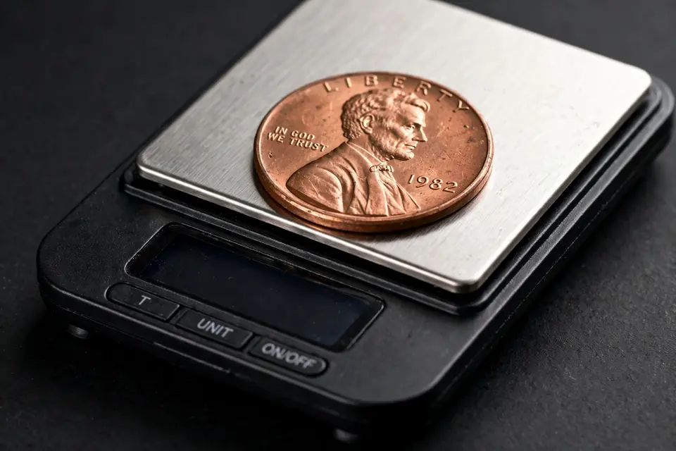 weighing a 1982 penny — 3.11 grams copper vs 2.5 grams zinc test