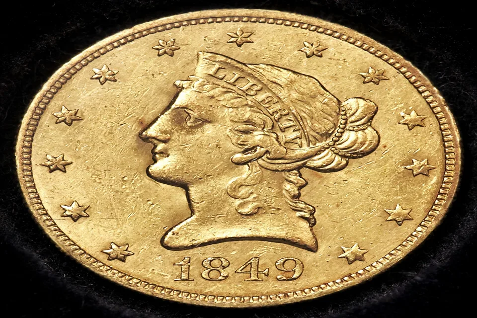 Gold dollar coin value — 1849 Liberty Head gold dollar obverse: common dates start at $450+, with $200+ in gold at today’s prices