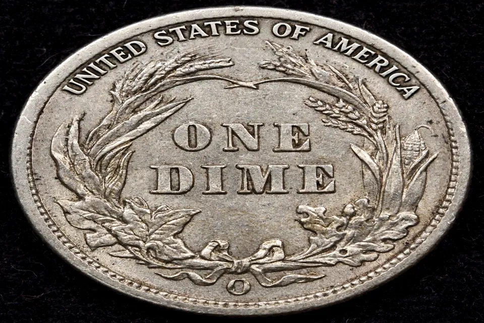 Barber dime reverse close-up — open wreath tied with a bow at the bottom, ONE DIME in the center, and the mint mark below the bow