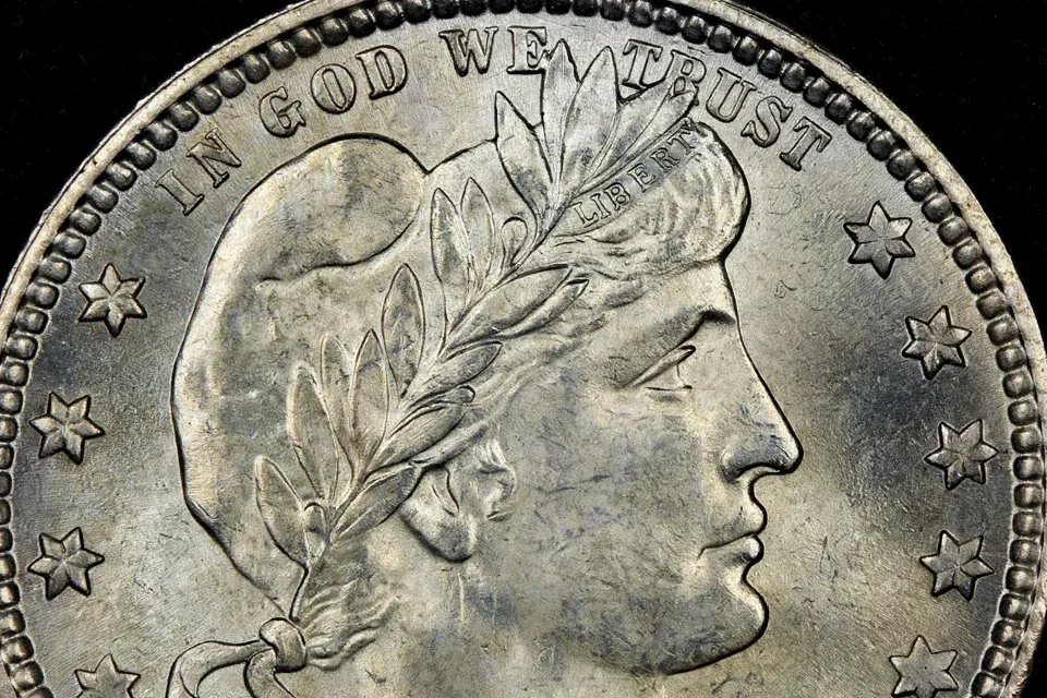 Barber quarter obverse close-up — the LIBERTY lettering in the headband above Liberty's forehead, the key grading check