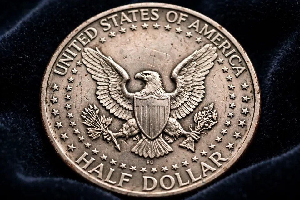 Kennedy half dollar reverse close-up — heraldic eagle with shield and HALF DOLLAR lettering