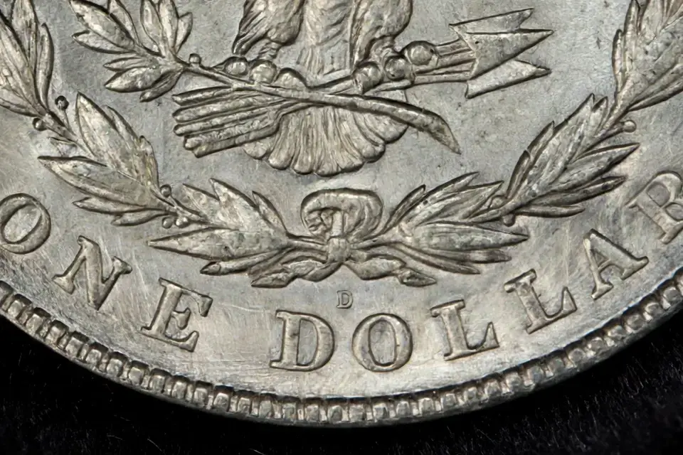 how much is a 1921 Morgan dollar worth — mint mark detail: D mint mark below the wreath above DO in DOLLAR on a 1921 Morgan reverse